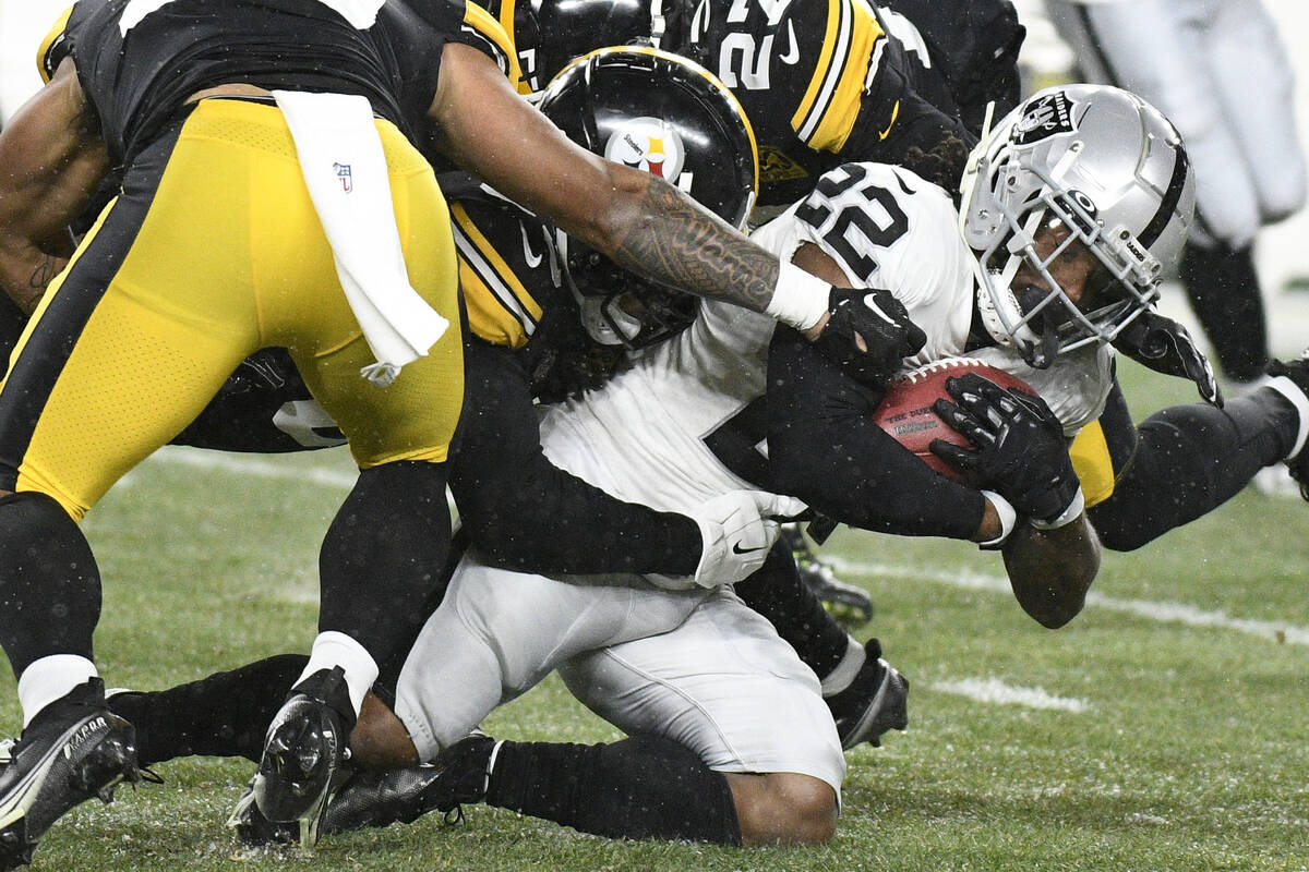 Las Vegas Raiders running back Ameer Abdullah (22) is tackled after a short gain during the fir ...