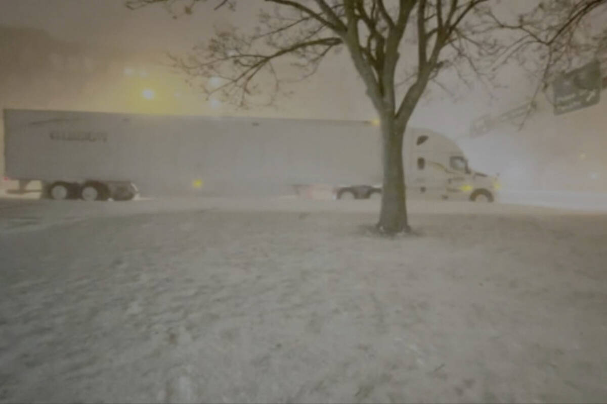 High winds and snow covers the streets and vehicles in Buffalo, N.Y. early Sunday, Dec. 25, 202 ...