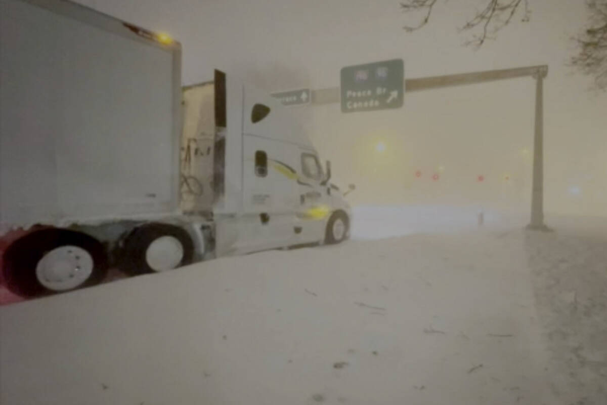 High winds and snow covers the streets and vehicles in Buffalo, N.Y. early Sunday, Dec. 25, 202 ...