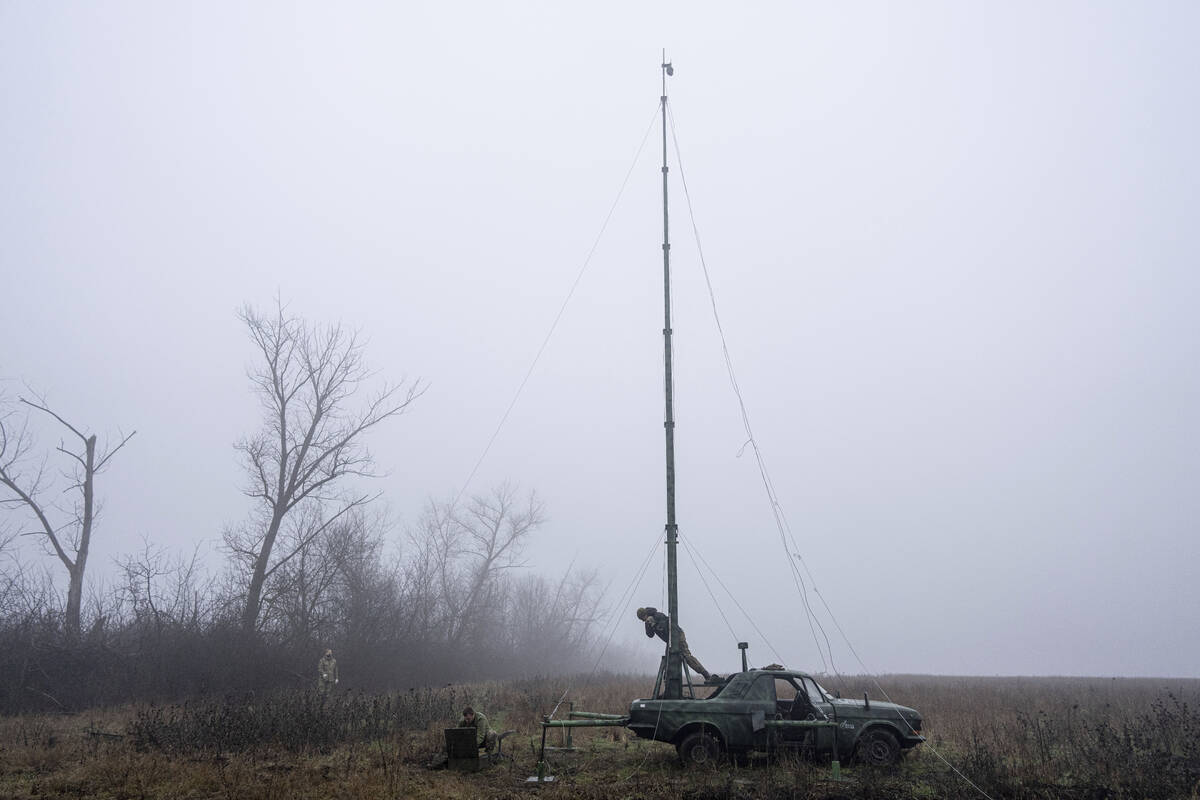 Ukrainian servicemen from 127 brigade prepare a telescopic tower with a remote camera installed ...