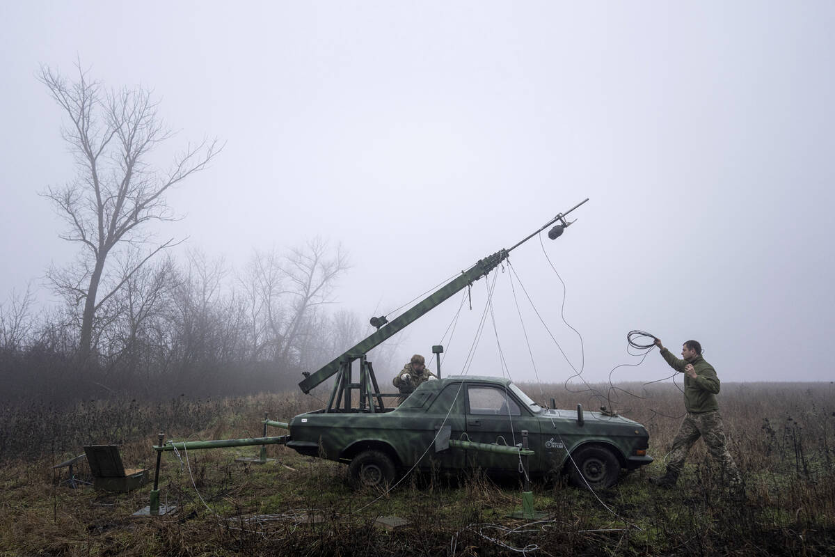 Ukrainian servicemen from 127 brigade prepare a telescopic tower with a remote camera installed ...