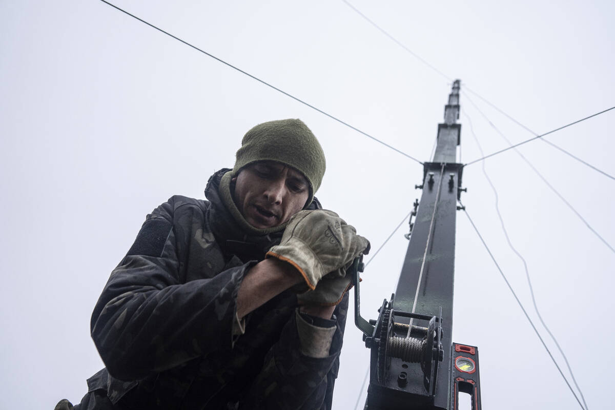 Ukrainian servicemen from 127 brigade prepare a telescopic tower with a remote camera installed ...