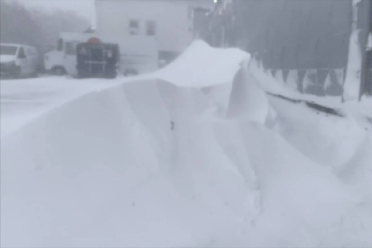 High winds and snow covers the streets and vehicles in Buffalo, N.Y. on Sunday, Dec. 25, 2022. ...