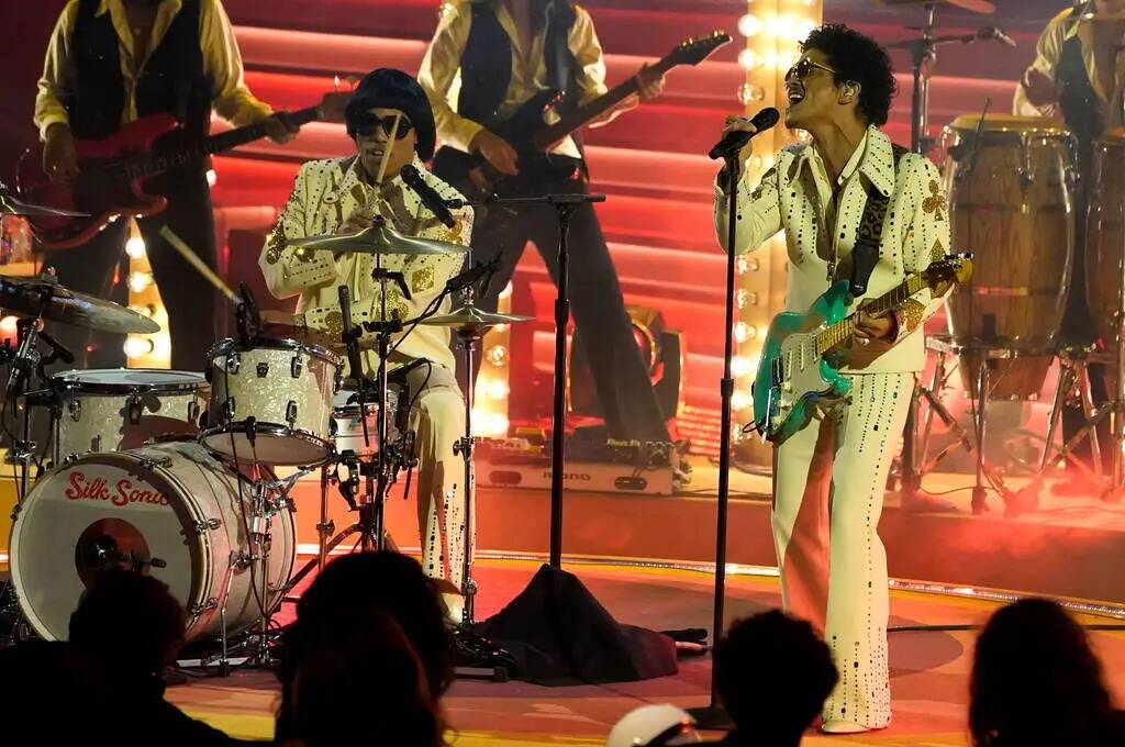 Anderson .Paak, left, and Bruno Mars of Silk Sonic perform "777" at the 64th Annual Grammy Awar ...