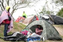 ]Migrants from Venezuela prepare for relocation to a refugee shelter in Matamoros, Mexico, on F ...