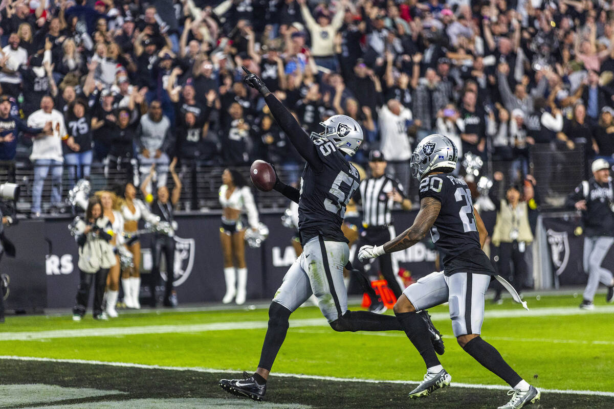 Raiders defensive end Chandler Jones (55) celebrates as he scores a game-winning touchdown over ...