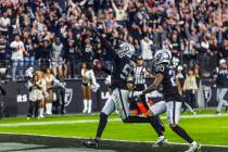 Raiders defensive end Chandler Jones (55) celebrates as he scores a game-winning touchdown over ...