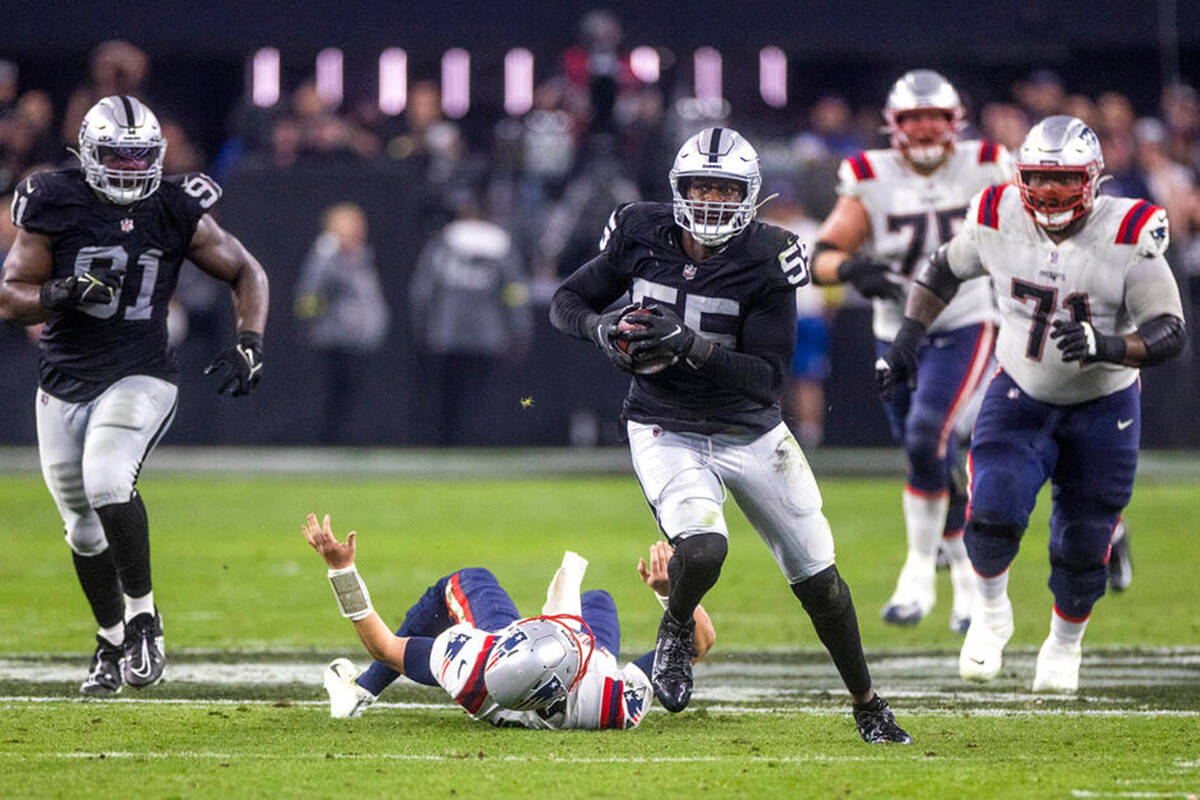 Raiders defensive end Chandler Jones (55) breaks away from a tackle attempt by New England Patr ...