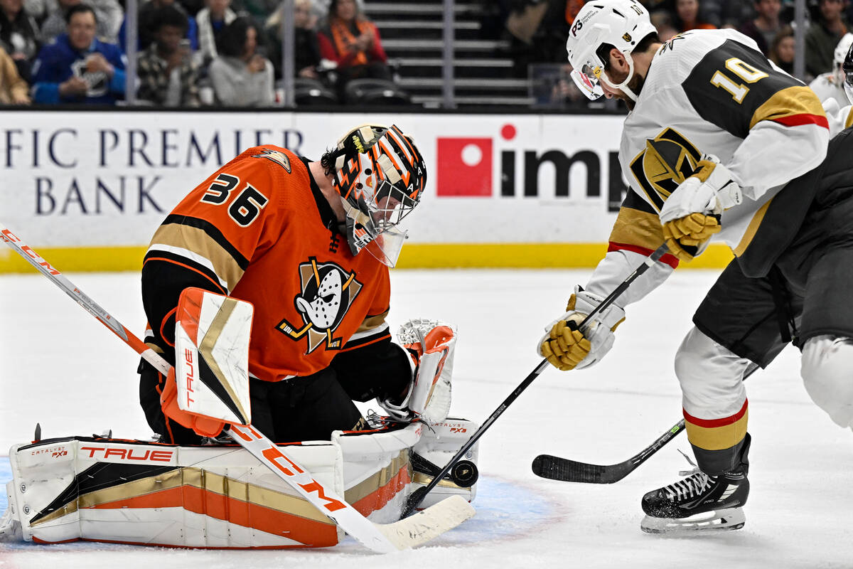 Anaheim Ducks goaltender John Gibson, left, blocks a shot by Vegas Golden Knights center Nicola ...