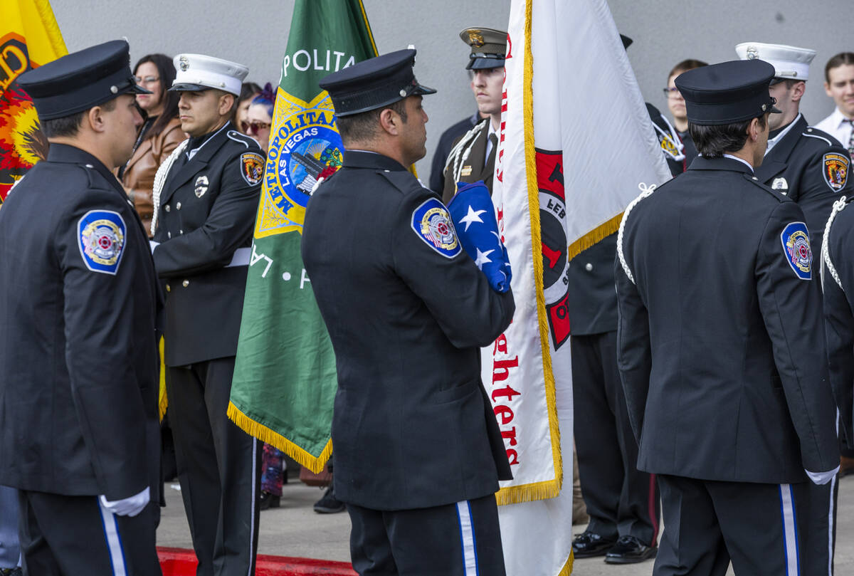 An American flag is carried in the processional as Henderson Fire Department Engineer Clete Naj ...