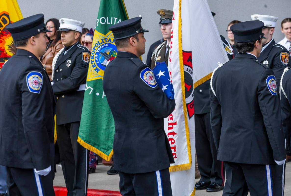 An American flag is carried in the processional as Henderson Fire Department Engineer Clete Naj ...