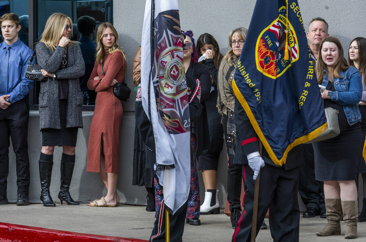 Mourners watch the processional as Henderson Fire Department Engineer Clete Najeeb Dadian is ho ...