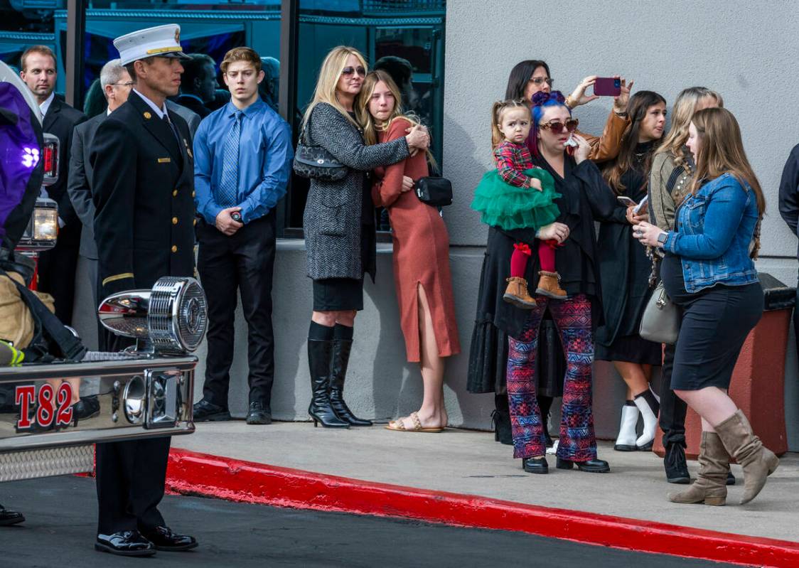 Mourners watch the processional as Henderson Fire Department Engineer Clete Najeeb Dadian is ho ...