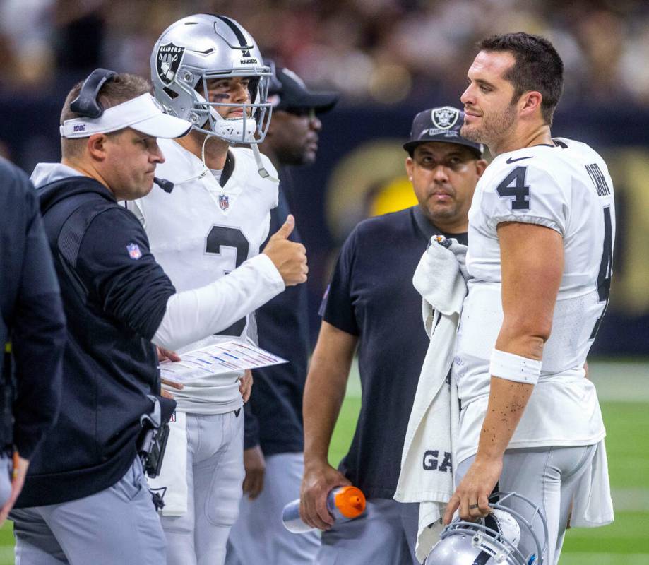 Raiders Head Coach Josh McDaniels with quarterback Jarrett Stidham (3) keeps this positive with ...