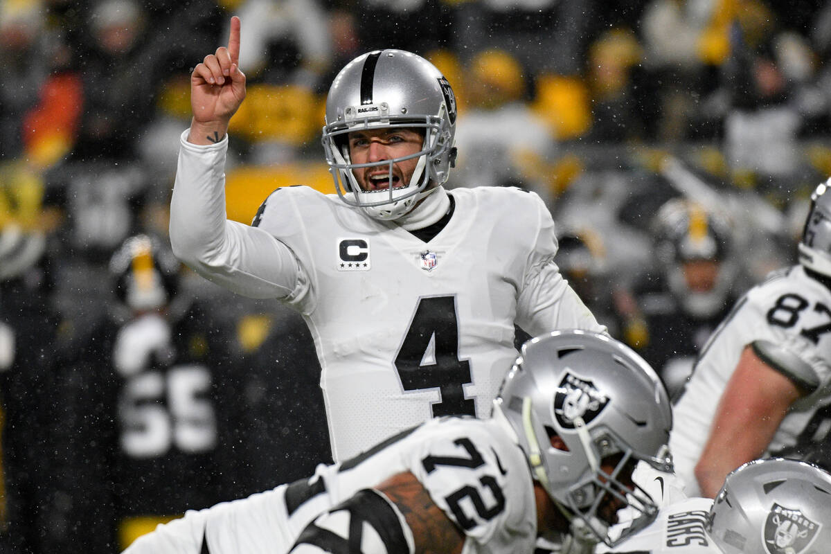 Las Vegas Raiders quarterback Derek Carr (4) calls signals during the first half of an NFL foot ...