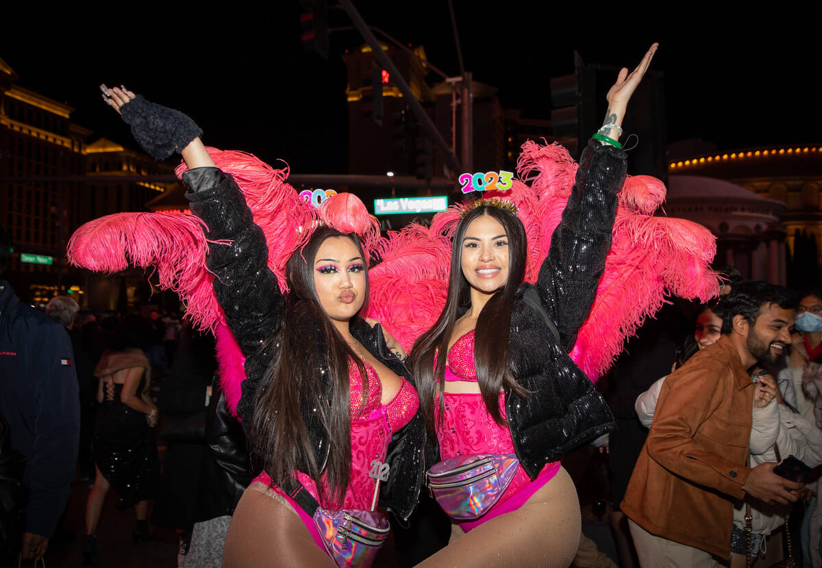 Showgirl impersonators Linda Terry, left, and Bri Taijeron, right, pose for a photo on the Stri ...