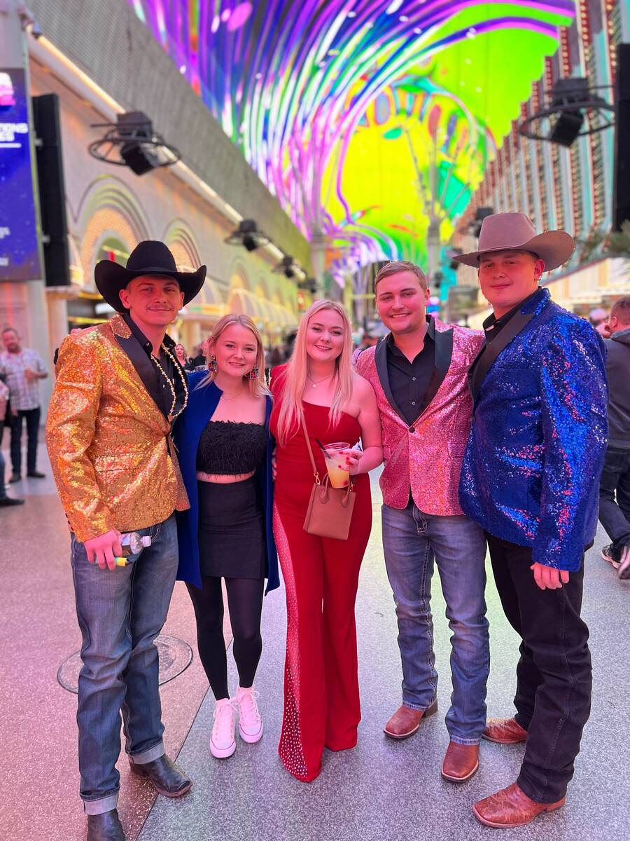 Ethan Klohn, far right, poses on Fremont Street with his brothers and friends on Saturday, Dec. ...
