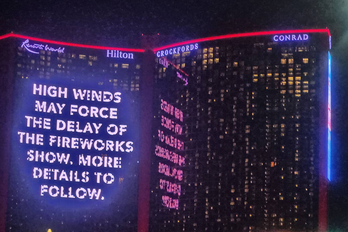 A sign at Resorts World warns that winds could delay the start of fireworks on New Year's Eve o ...