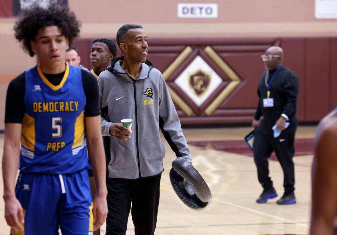 Democracy Prep assistant coach Mark Coleman, right, during halftime of a game against Anchorage ...