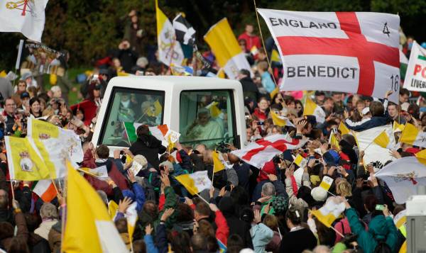Pope Benedict XVI is cheered by faithful upon his arrival in Cofton park to celebrate a beatifi ...