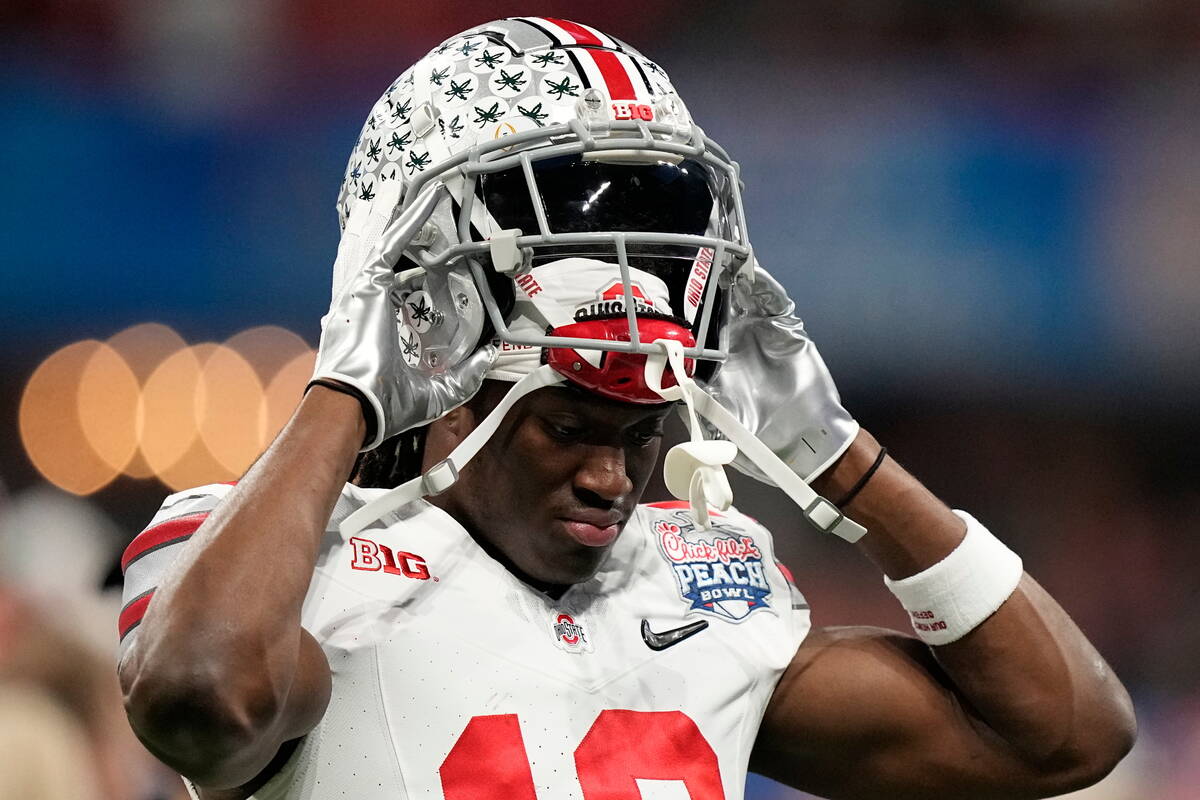 Ohio State wide receiver Marvin Harrison Jr. (18) warms up before the Peach Bowl NCAA college f ...