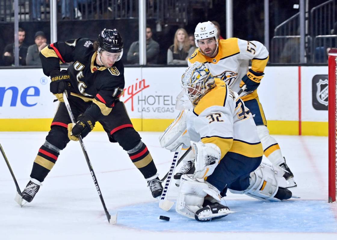 Vegas Golden Knights defenseman Ben Hutton (17) shoots against Nashville Predators goaltender K ...