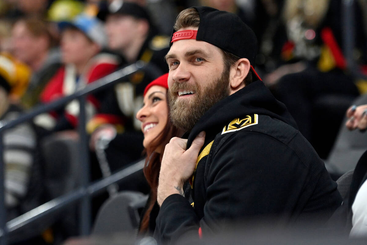 Major League Baseball player Bryce Harper, right, and Kayla Varner attend an NHL hockey game be ...