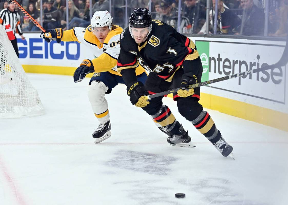 Nashville Predators center Mikael Granlund (64) and Vegas Golden Knights defenseman Brayden McN ...