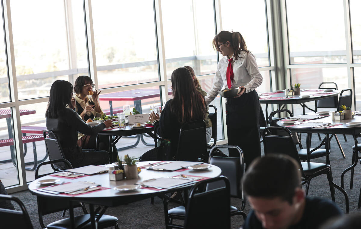 Southeast Career Technical Academy culinary student Isabella Stover serves diners at the studen ...