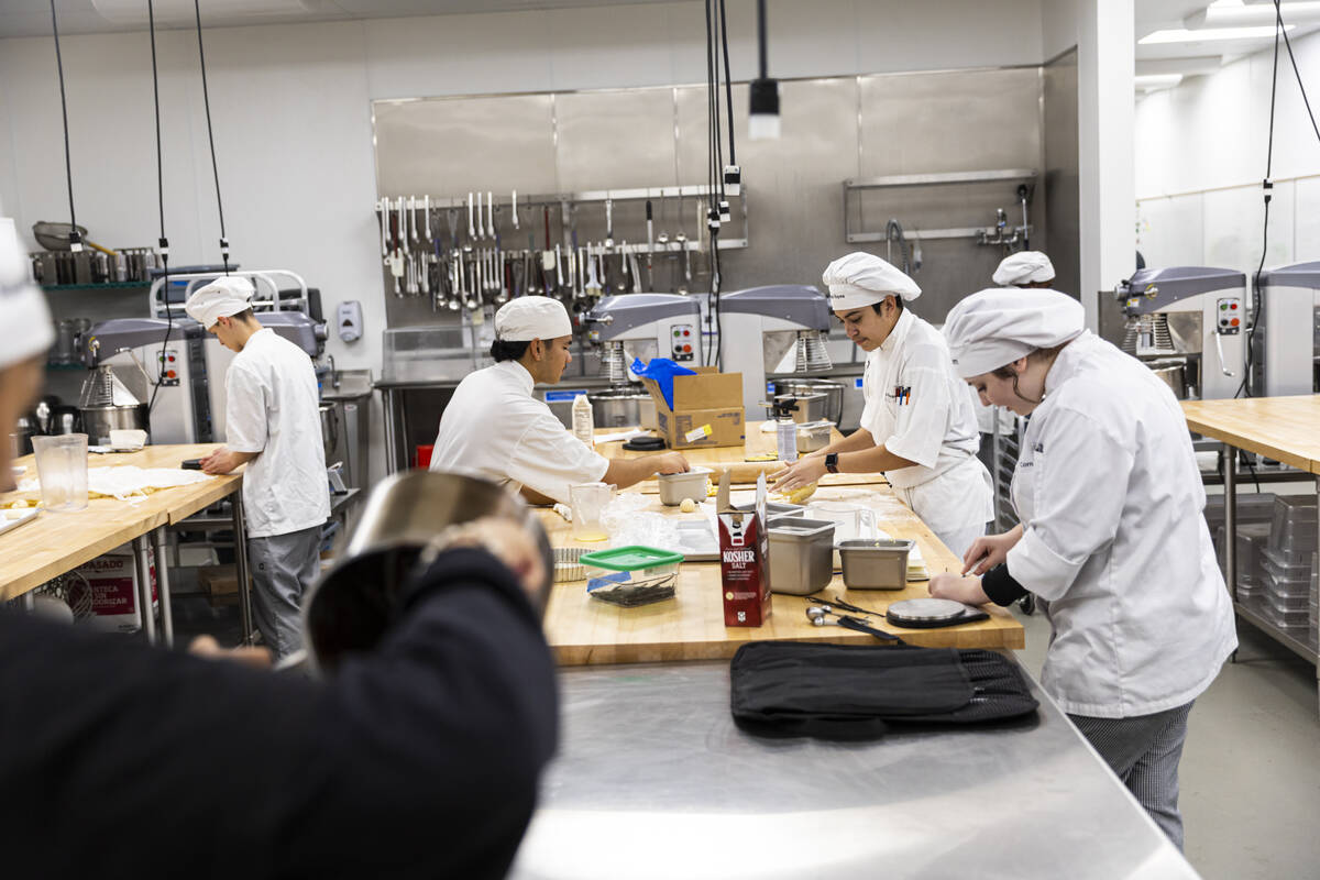 Southeast Career Technical Academy culinary students prepare bread rolls in the kitchen on Tues ...