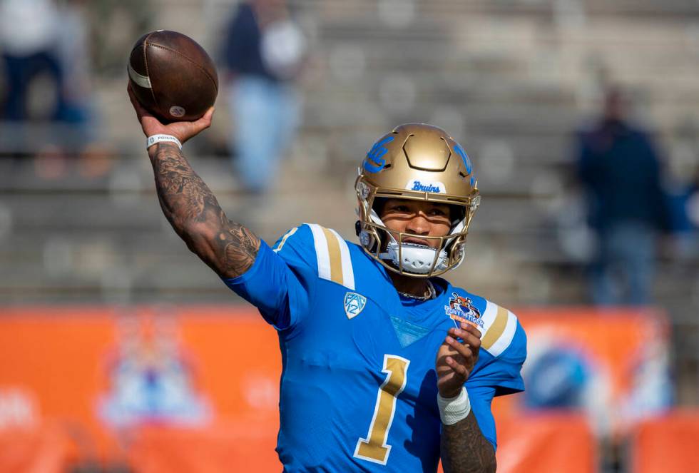 UCLA quarterback Dorian Thompson-Robinson throws during warm ups before the start of the Sun Bo ...