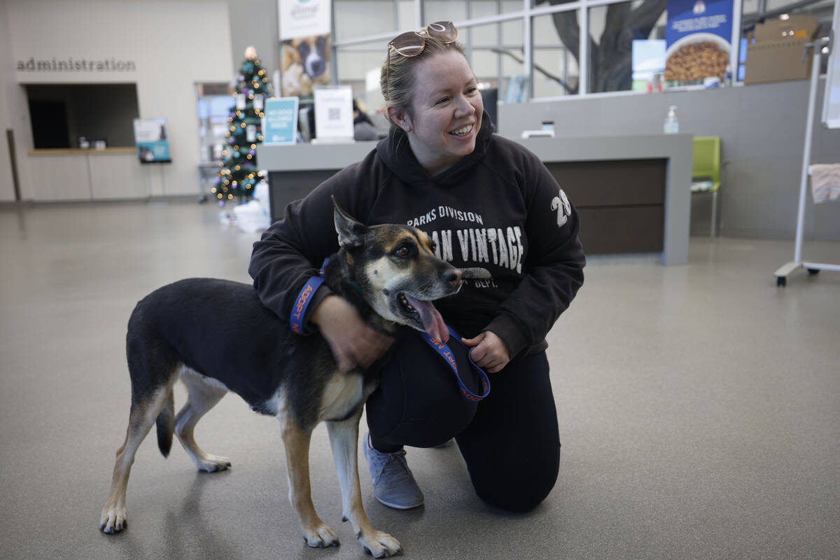 Samantha Miles of Las Vegas drops off a dog named Bones, at The Animal Foundation, Friday, Dec. ...