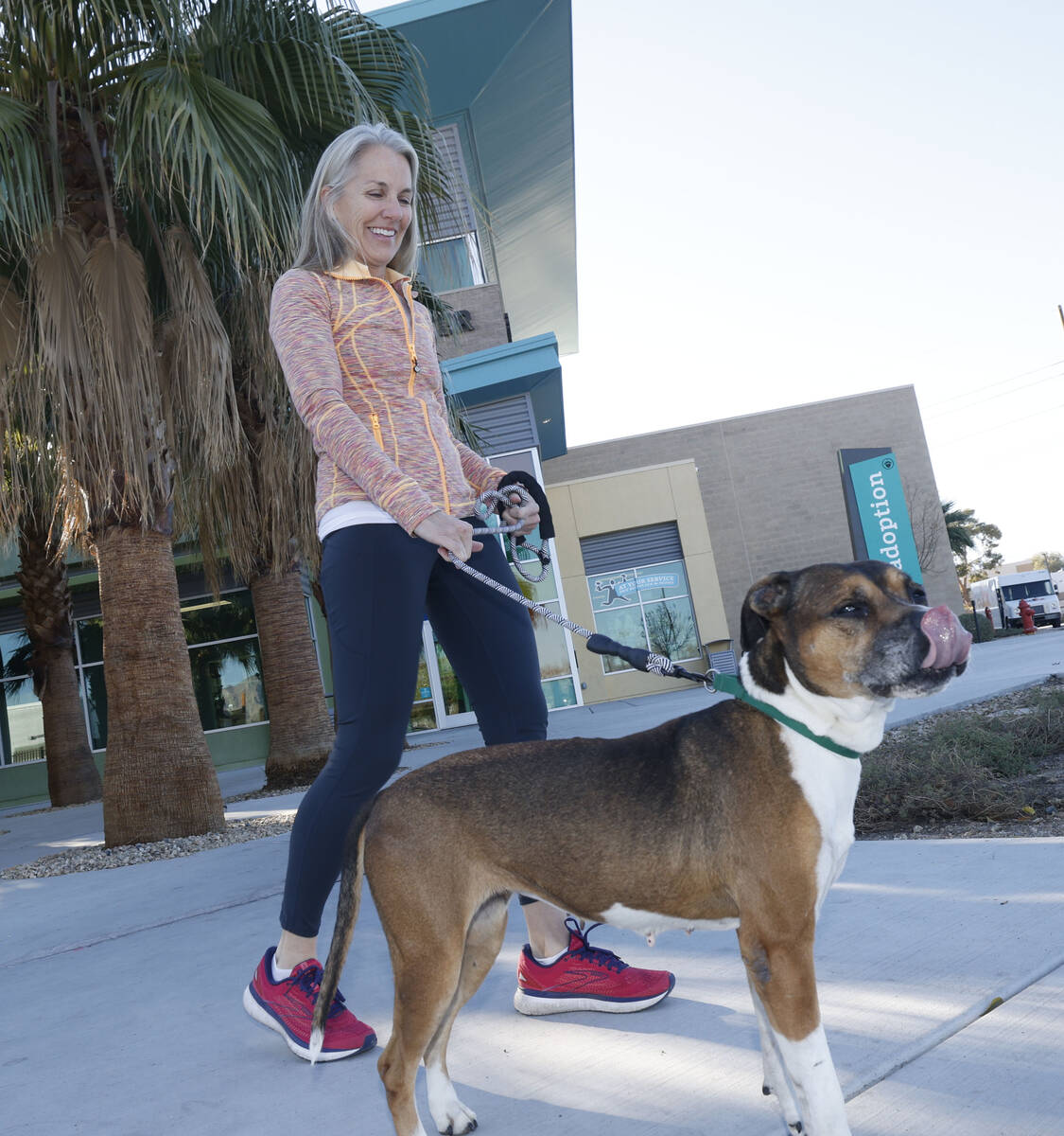 Mary Margaret Madden of Las Vegas poses for a photo with Lumpia, a dog who is able to be foster ...