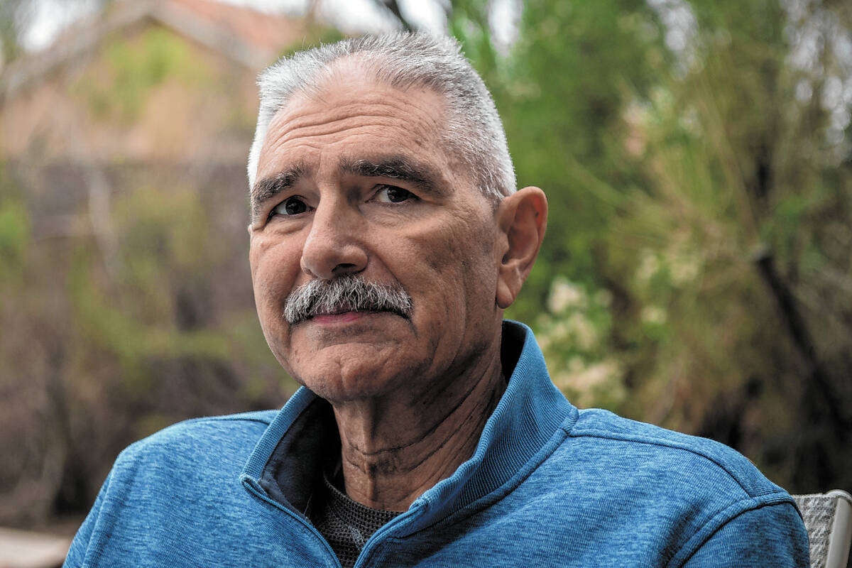 Jim Bolla, former UNLV women's basketball coach, poses for a photograph outside of his home in ...