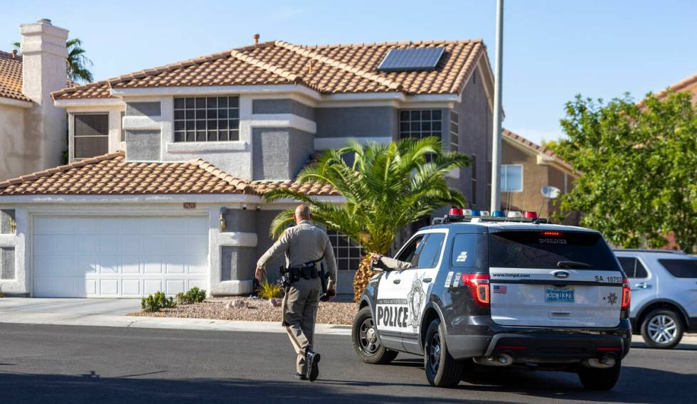 Metro Officers begin to set up about the home of Robert Telles along the 9600 block of West Spa ...