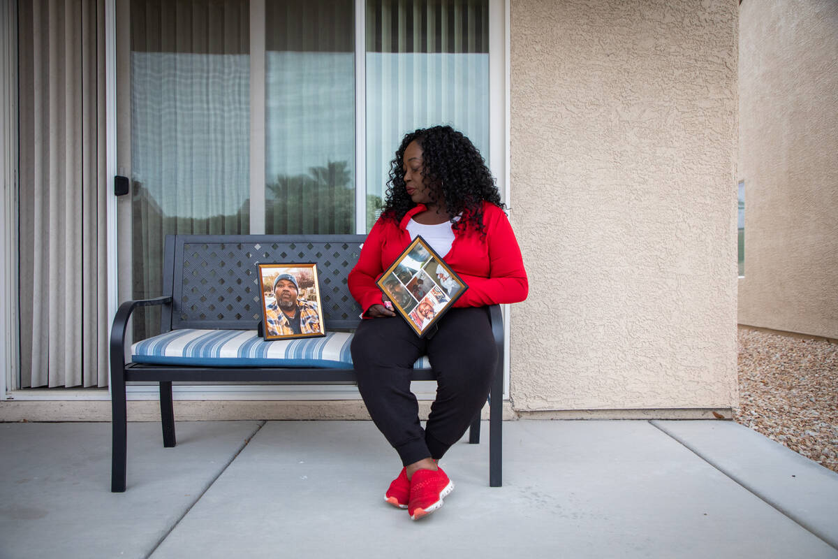 Dorothy Williams poses for a portrait with framed photos of her brother, Kevin Fleming, on Frid ...