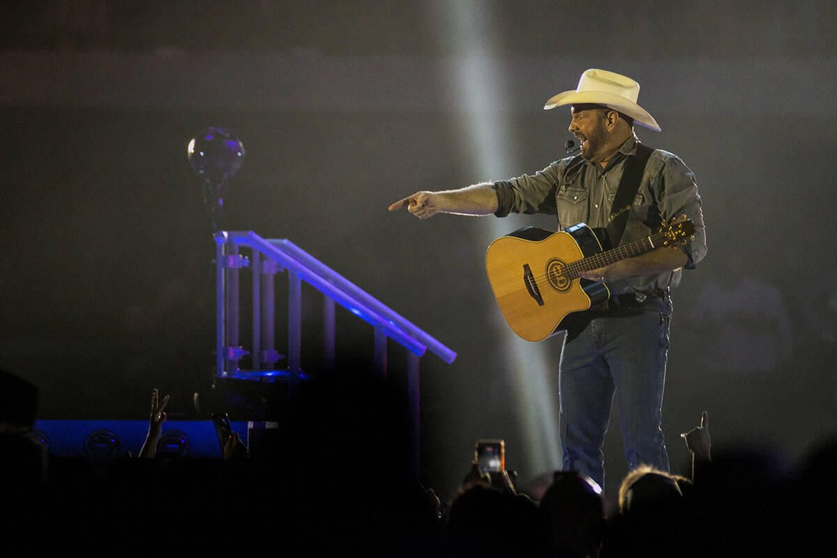 Garth Brooks performs before the crowd at Allegiant Stadium on Friday, July 10 2021, in Las Veg ...