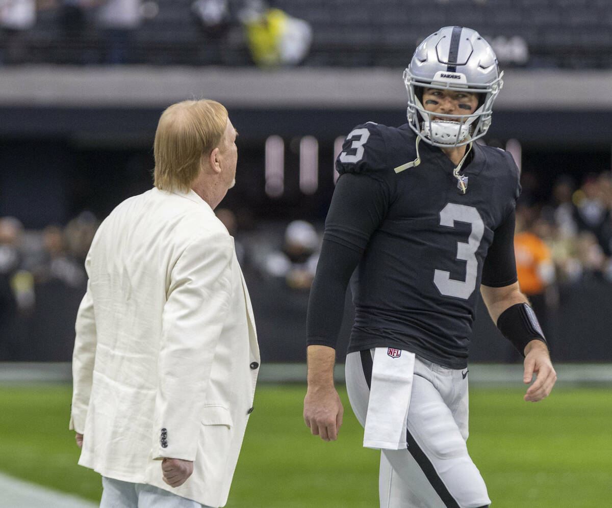 Raiders owner Mark Davis, left, shares a word with Raiders quarterback Jarrett Stidham (3) befo ...