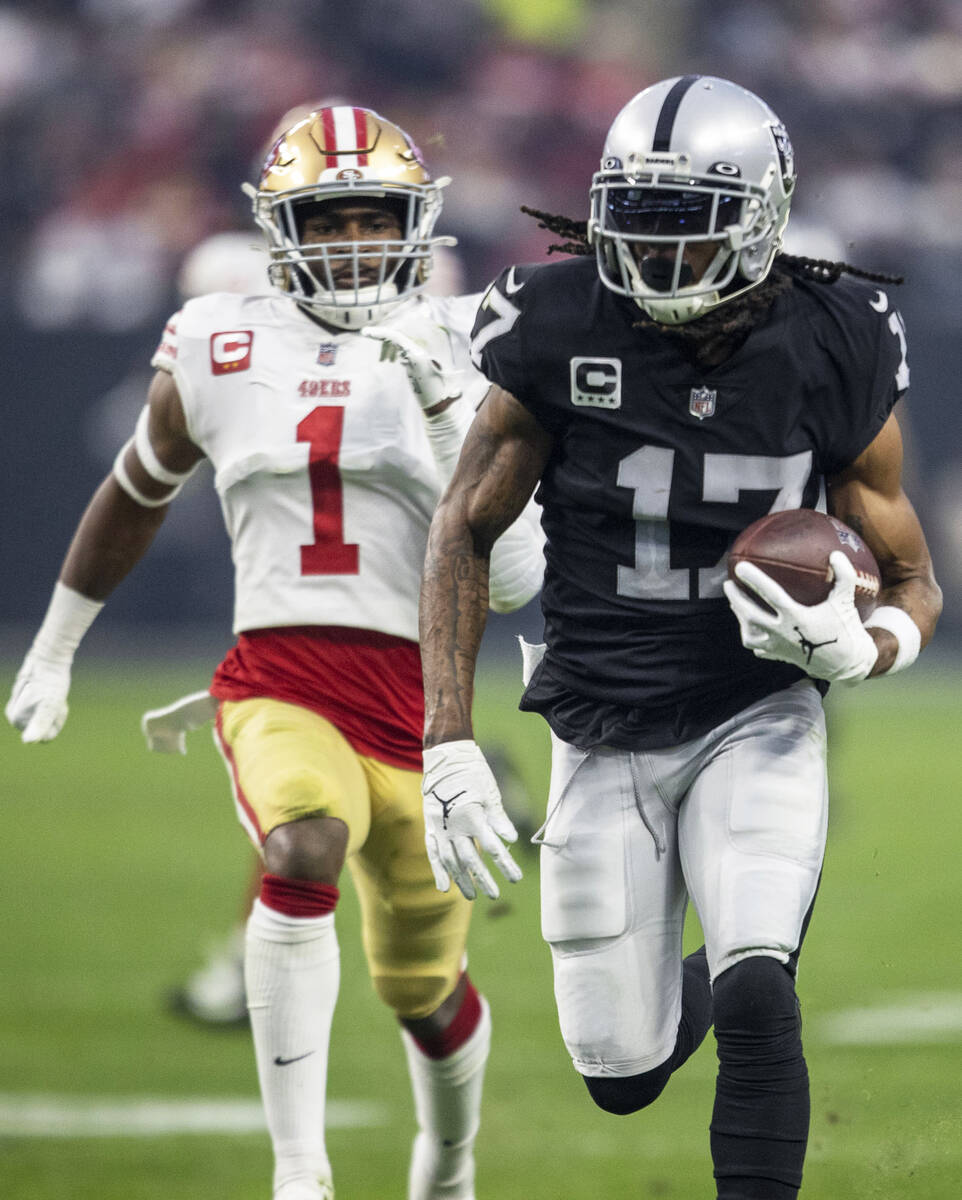 Raiders wide receiver Davante Adams (17) runs past San Francisco 49ers cornerback Jimmie Ward ( ...