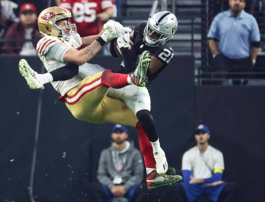 Raiders cornerback Amik Robertson (21) intercepts a pass intended for San Francisco 49ers tight ...