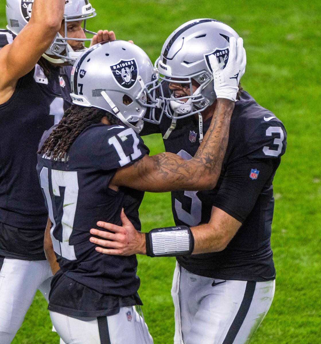 Raiders quarterback Jarrett Stidham (3) celebrates a touchdown with teammate wide receiver Dava ...