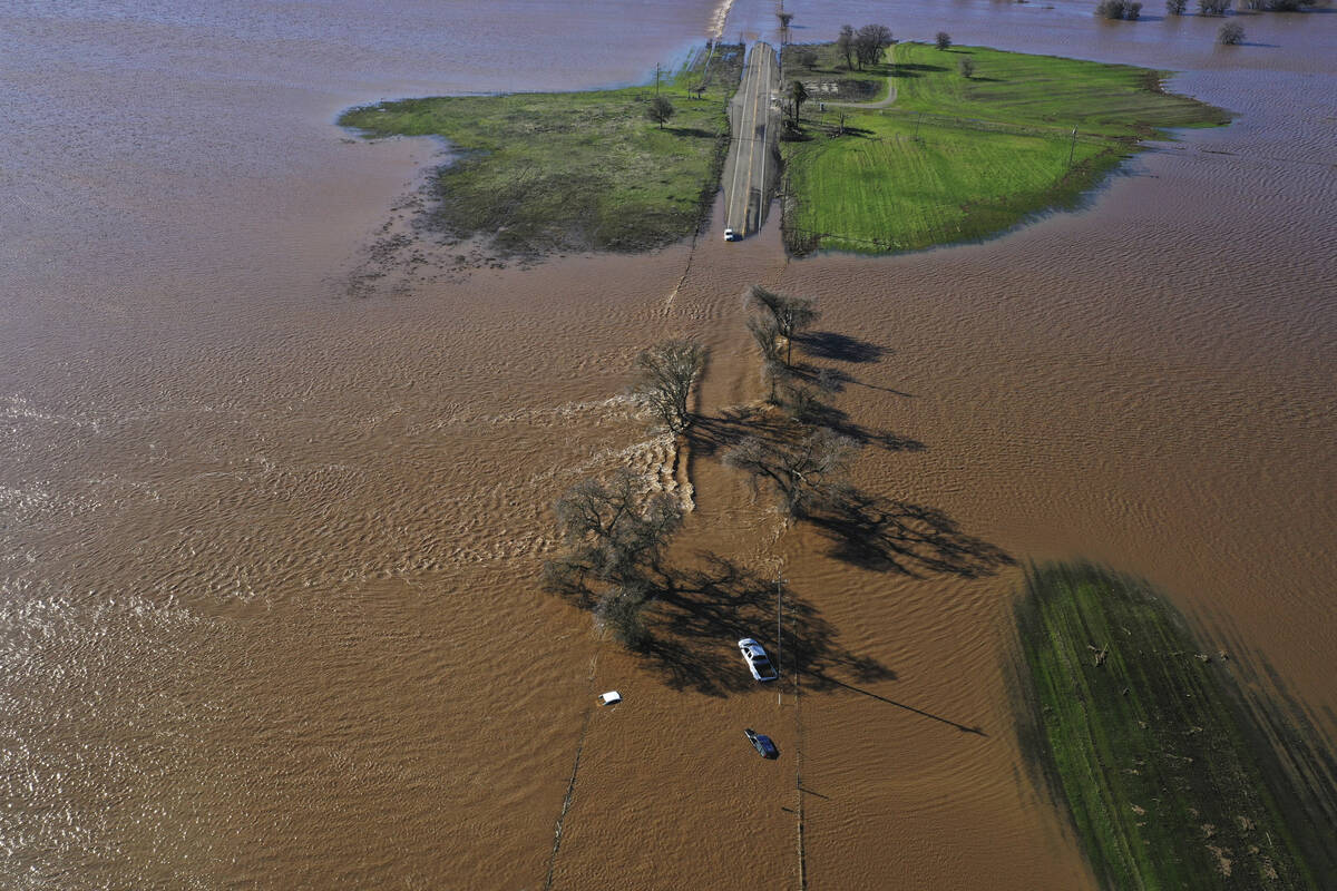 Three vehicles are submerged on Dillard Road west of Highway 99 in south Sacramento County in W ...