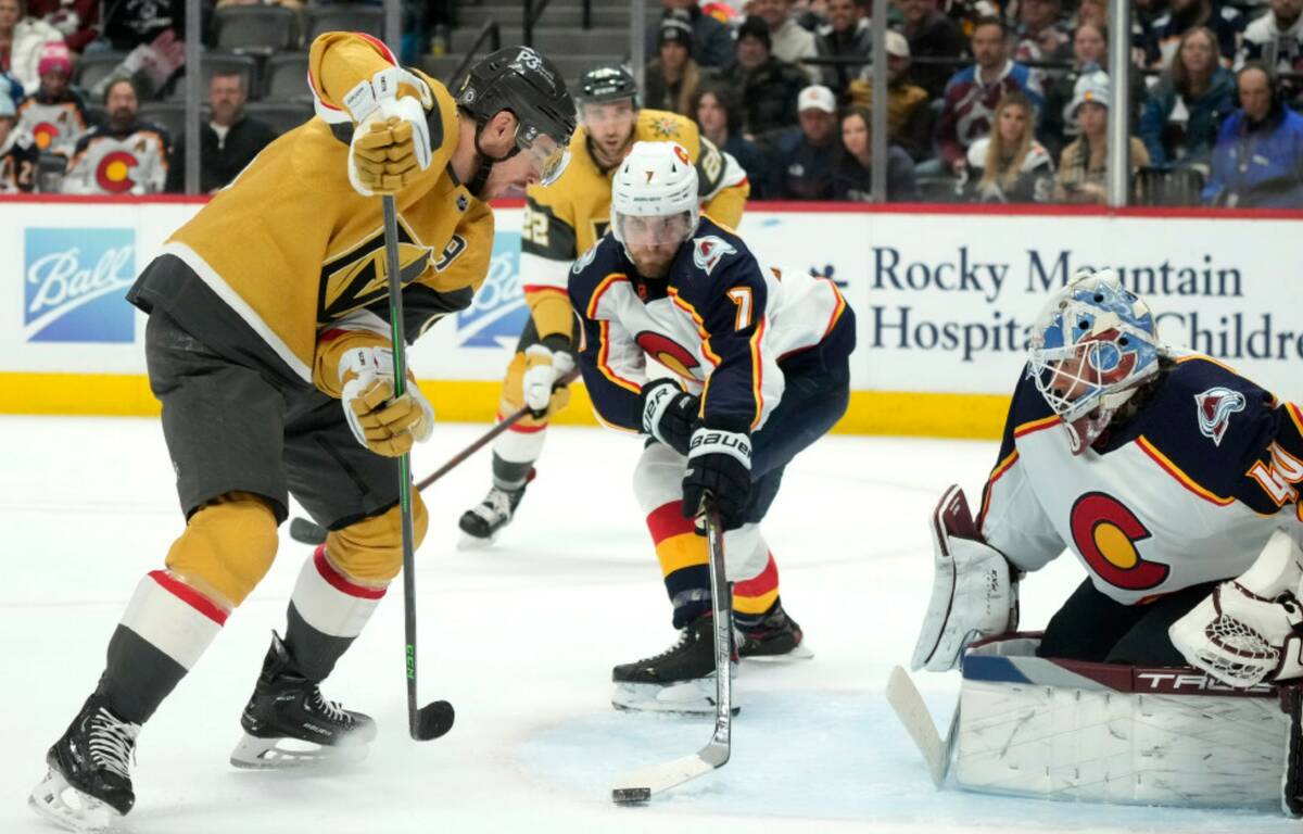 Vegas Golden Knights right wing Reilly Smith, left, loses control of the puck as Colorado Avala ...