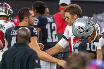 Las Vegas Raiders quarterback Derek Carr (4) and Tampa Bay Buccaneers quarterback Tom Brady (12 ...