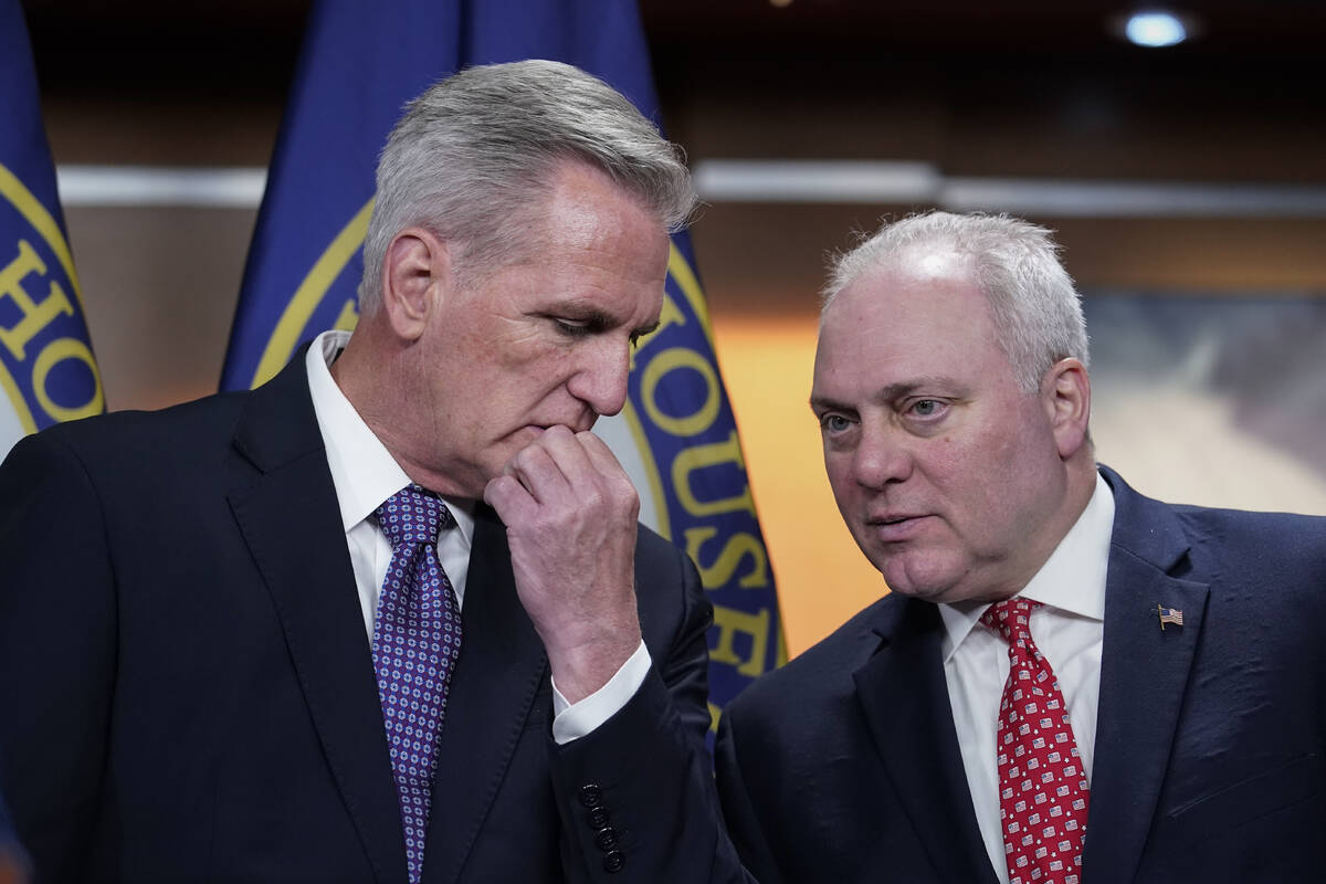 FILE - House Minority Leader Kevin McCarthy, R-Calif., left, confers with Minority Whip Steve S ...