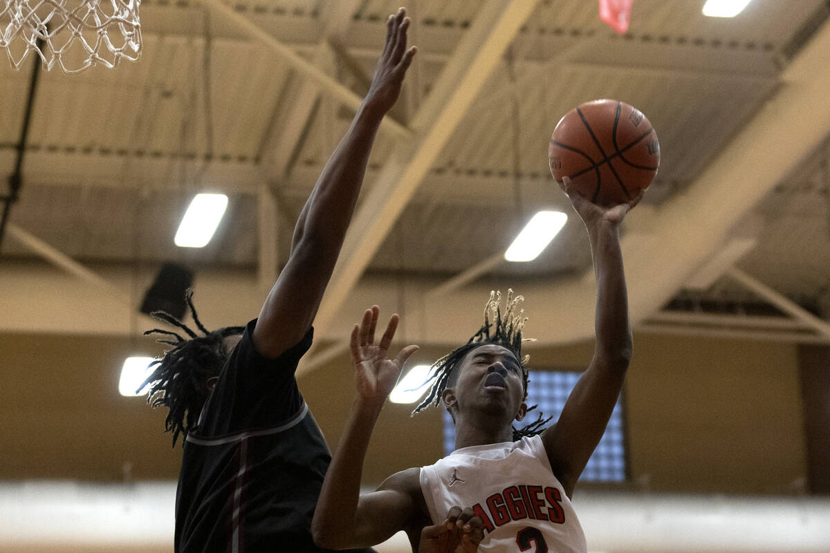 Arbor View’s Sebastian Knox (2) shoots against Cimarron-Memorial’s Gerald Patters ...