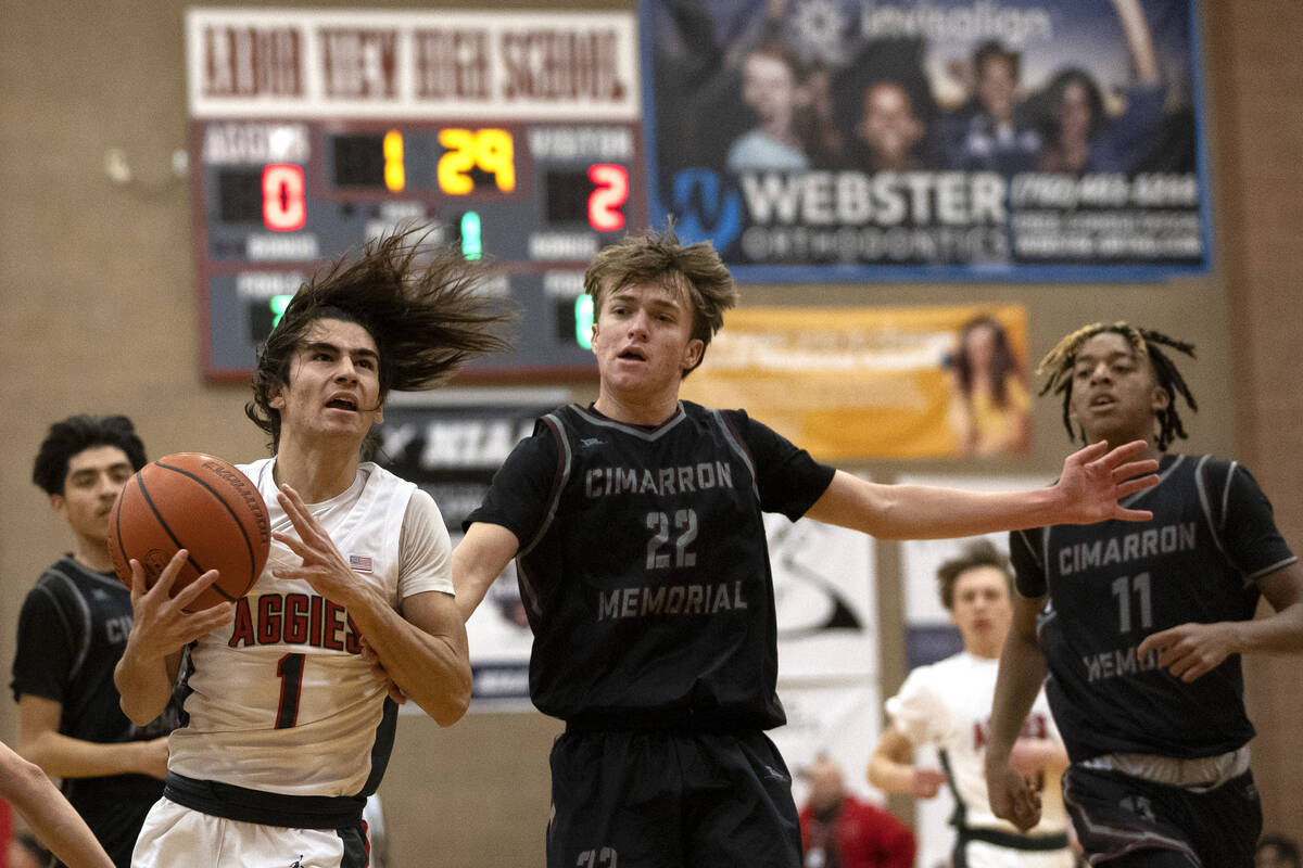 Arbor View’s Maximus Romero (1) drives toward the hoop while Cimarron-Memorial’s ...