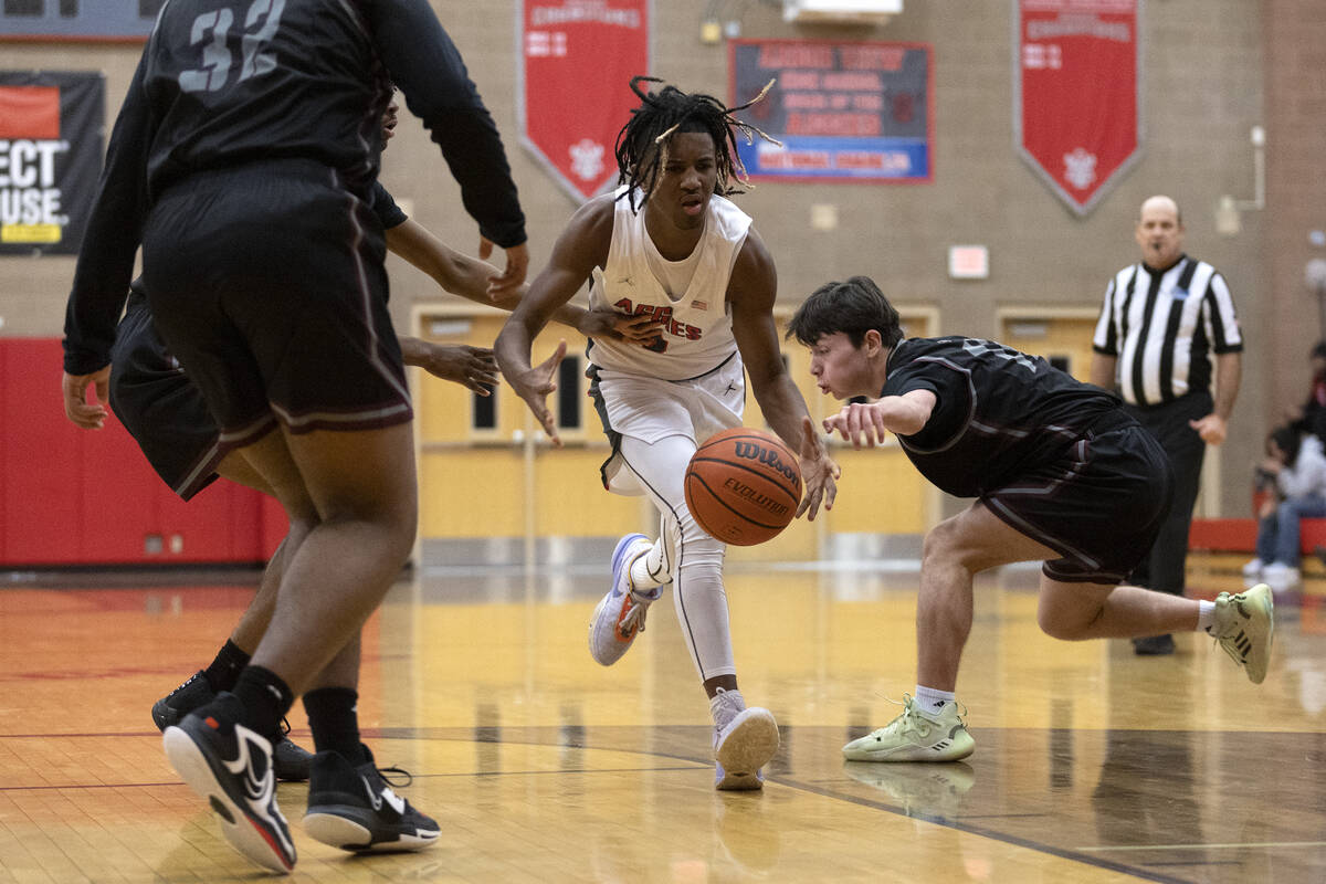 Arbor View’s Sebastian Knox (2) drives past Cimarron-Memorial’s David Lynch, righ ...