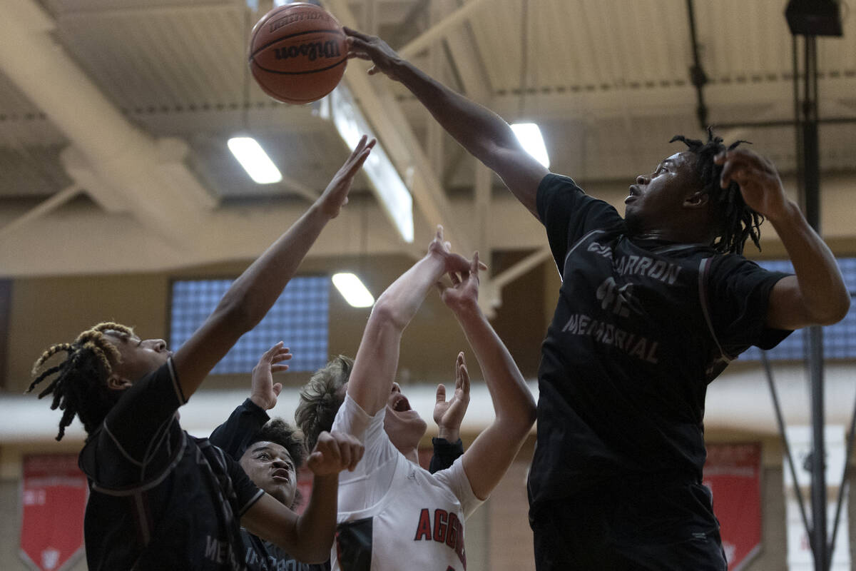 Cimarron-Memorial’s Ricky Adams (42) slaps the ball away from Arbor View’s Jalen ...