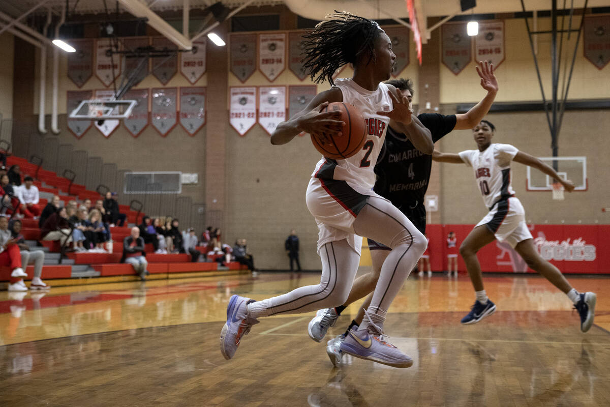 Arbor View’s Sebastian Knox (2) drives toward the hoop during a boys high school basketb ...